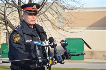 Peel police inspector Tim Nagtegaal fielded questions about two overnight shootings in Mississauga from the scene of one incident outside a gas station on Britannia Road.